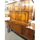 A mahogany serpentine fronted sideboard, and a mahogany and flame mahogany television type cabinet.