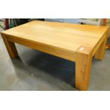 A modern light oak coffee table.