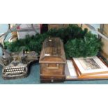 An oak cased sewing machine, Oliver typewriter, pictures, prints, etc. (contents of under one table)