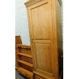 A pine single wardrobe, and a pine hanging shelf, with three drawers to base. (2)