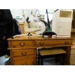 A pine single pedestal table, piano stool, and a white painted side cabinet. (3) The upholstery in t