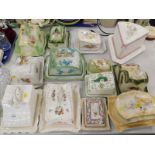 A collection of 19thC and later cheese dishes and covers, to include floral examples, a basket weave