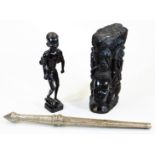 A heavily carved African tribal style figure, with foot raised on a canted base, unmarked, 32cm