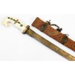 A 19thC Indian Shamshir sword, the slightly curved blade decorated with a hunting scene in gold