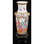 A Cantonese famille rose baluster vase, decorated with panels of court figures surrounded by flowers