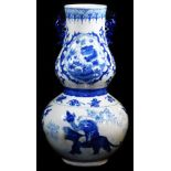 A late 20thC Chinese porcelain double gourd vase, decorated in underglaze blue with figures and