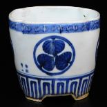 A lobed Japanese porcelain orchid pot, decorated with the Aoi mon of the Tokugawa family between key