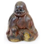 A Japanese Bizen figure of Okame, smiling blissfully as she pleasures herself, Meiji period, 15.