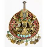 An early 20thC Indian jewel, centred by Lakshmi and set with turquoise, green and pink stones, on