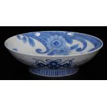 A large Japanese porcelain underglaze blue and white Nabeshima dish, decorated with stylised peonies