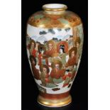 A Japanese Satsuma baluster vase, decorated with haloed deities in a mountainous landscape,