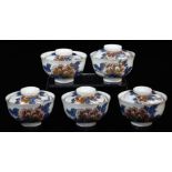 A set of five Japanese porcelain bowls and covers, decorated blue, peach and gold with branches of