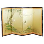 A 20thC four fold table Japanese screen, decorated with birds among prunus and bamboo, signed,