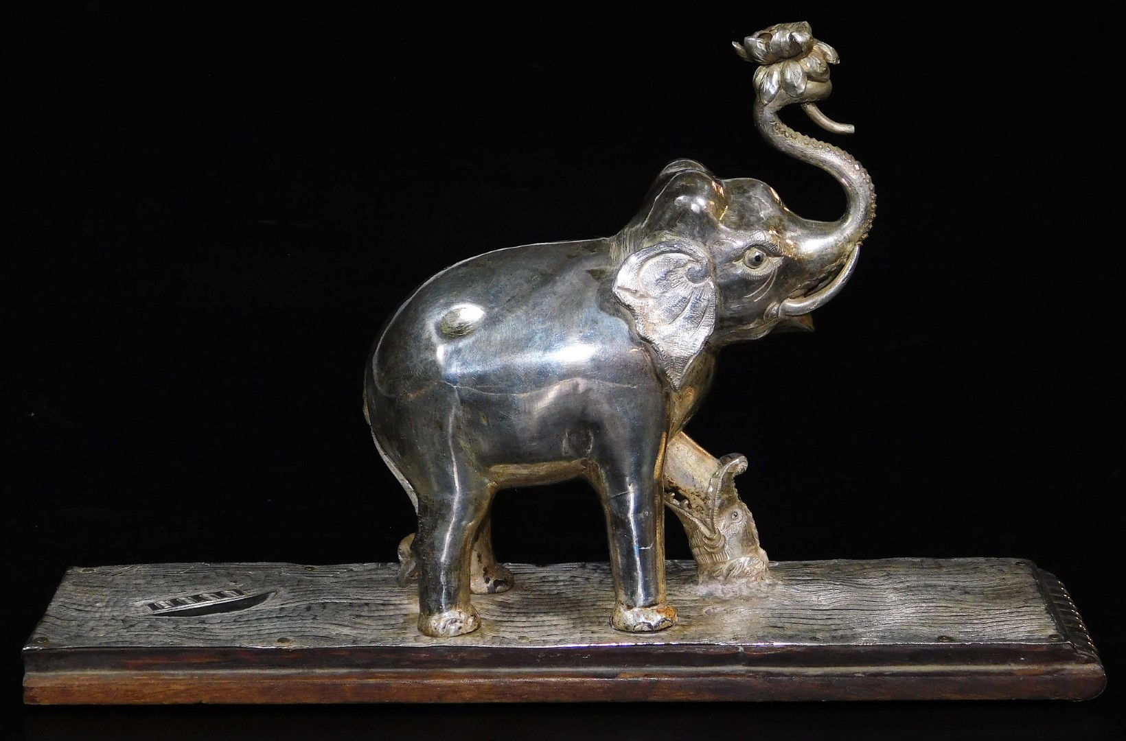 An early 20thC ceremonial figure group of an elephant being attacked by a wild beast, with trunk - Image 4 of 6