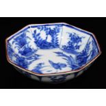 A fine Japanese Arita blue and white octagonal porcelain dish, decorated with a central panel of a