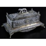 An early 20thC Indian ceremonial freedom casket, of rectangular form with tiger knop, urn finials