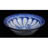 A Japanese Arita blue and white porcelain dish, decorated with a sixteen petal chrysanthemum mon and