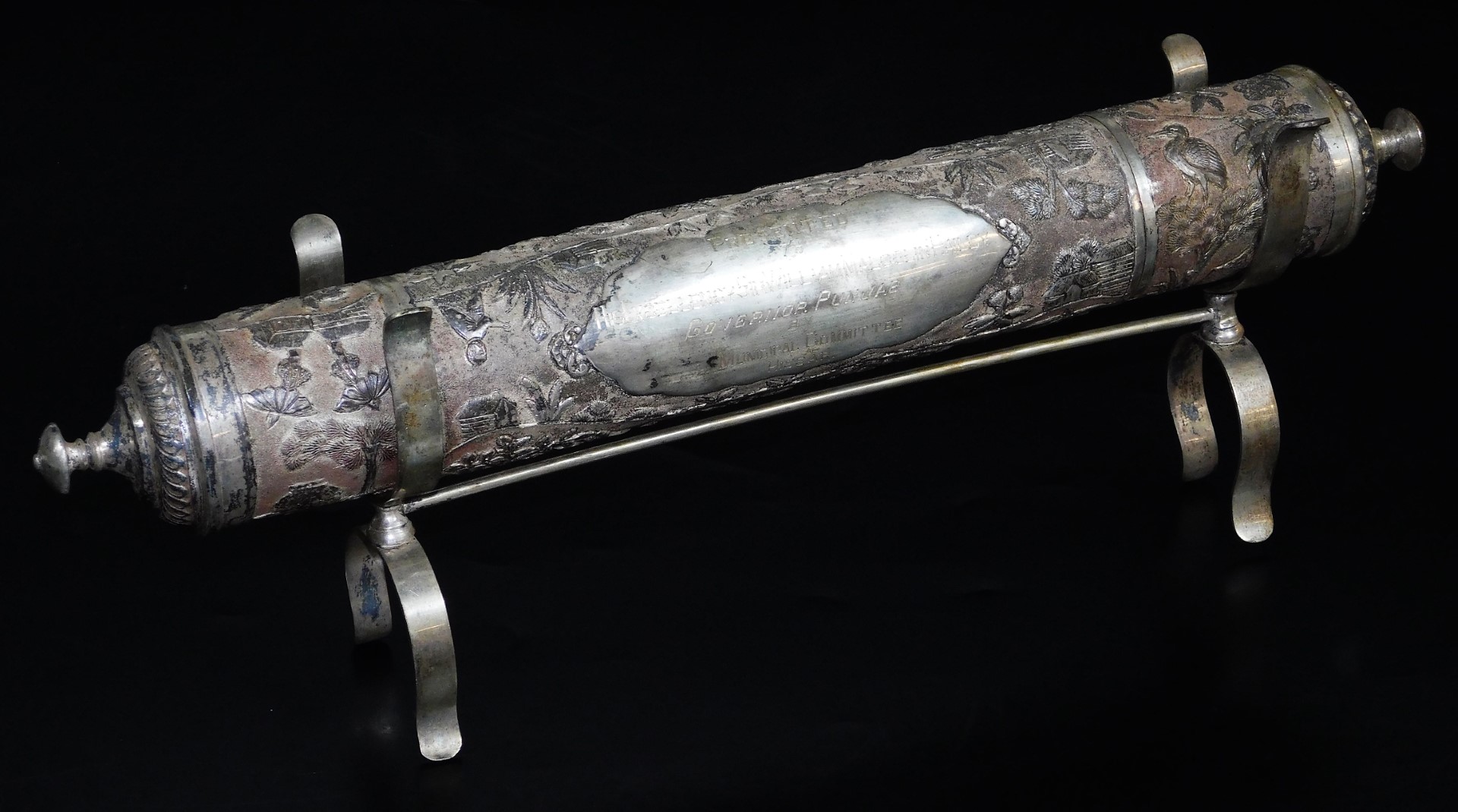 An early 20thC Indian ceremonial freedom casket, of cylindrical form, on fixed stand, heavily