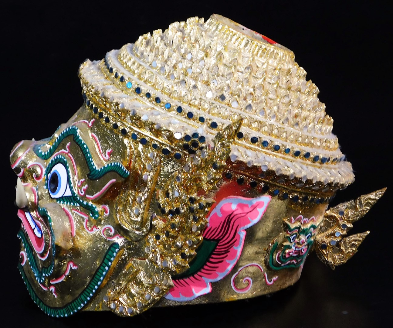 A Thai face mask, heavily decorated with mirrored glass sections set with tusks and with fierce - Image 3 of 16