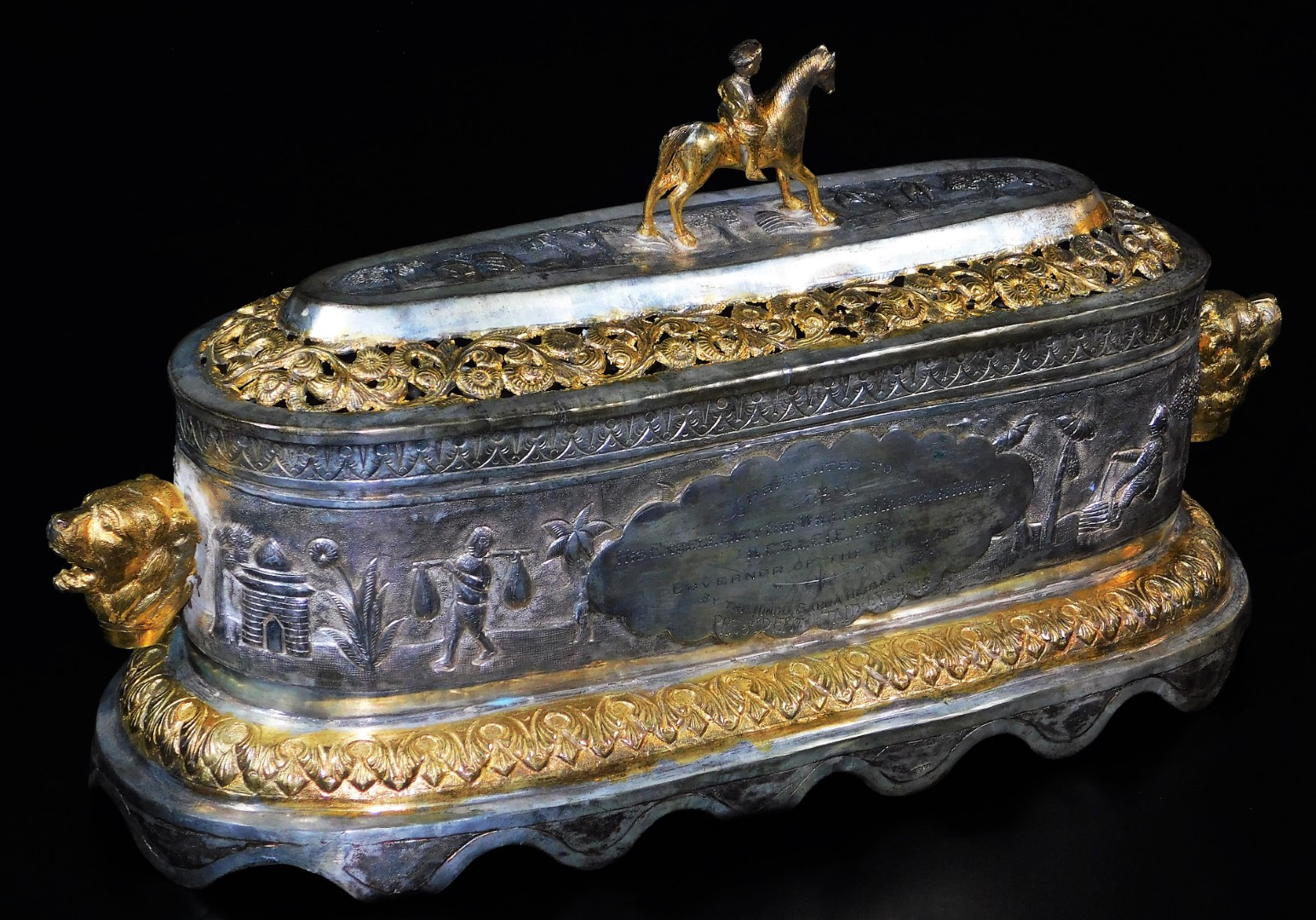 A highly elaborate Indian ceremonial freedom casket, of oval form, with horse and rider knop,
