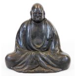 A Japanese bronze figure of seated Daruma in mediation, signed Teruun to the side above seal Tang,