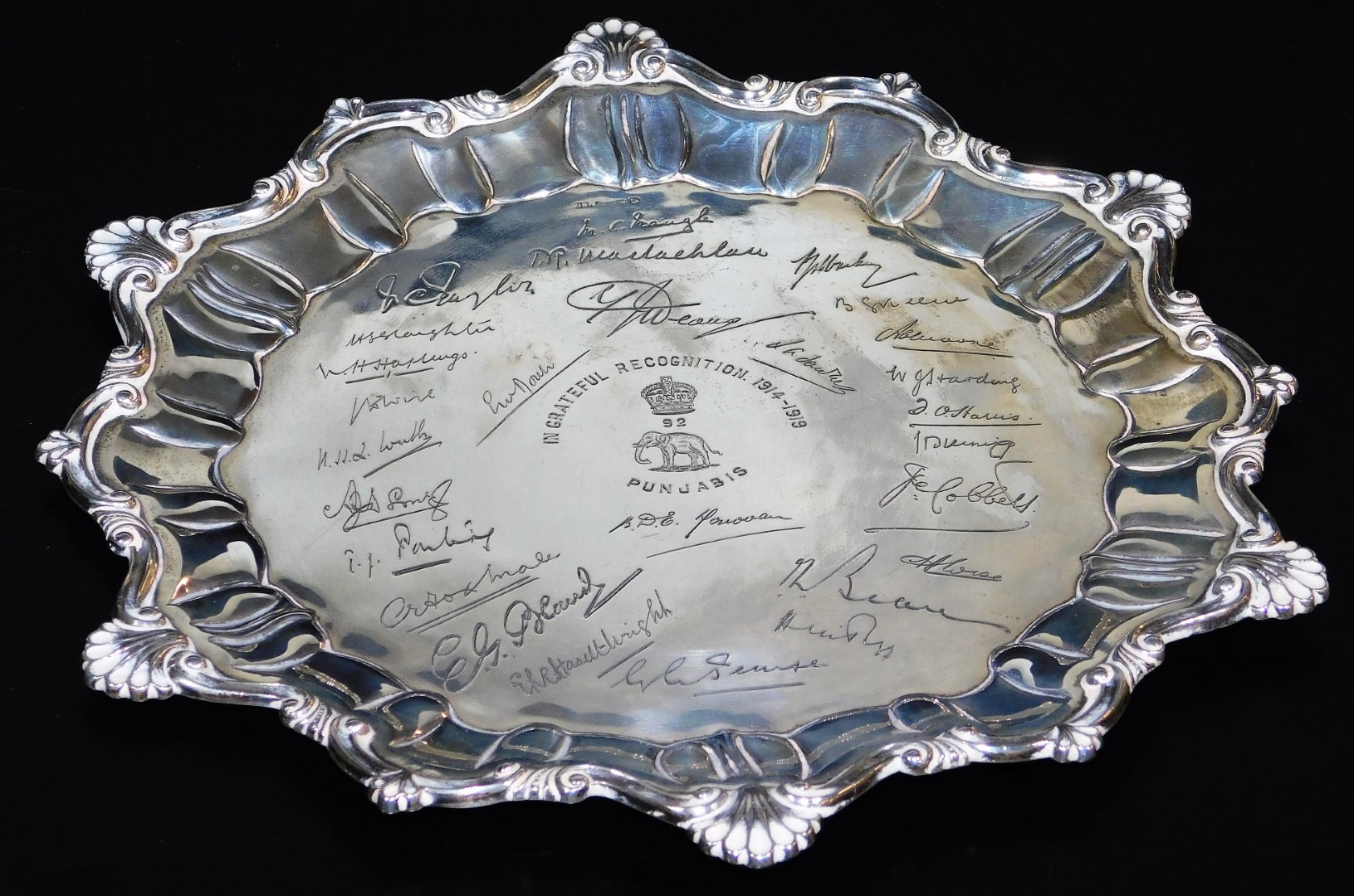 A ceremonial Indian salver, with a pie crust and heart shaped part gadrooned border, with various