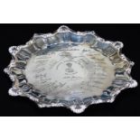 A ceremonial Indian salver, with a pie crust and heart shaped part gadrooned border, with various
