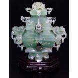 An elaborate Chinese green quartz quadruple vase, with four compartments and dragon head handles,