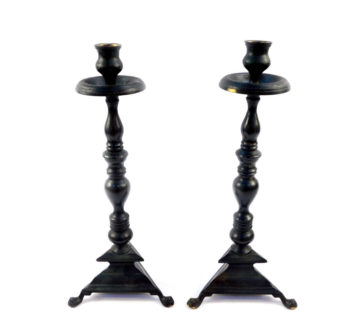 A pair of bronzed metal candlesticks, 39.5cm high.