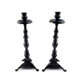 A pair of bronzed metal candlesticks, 39.5cm high.