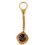 A Middle Eastern 18ct gold and blue enamel fob on chain, 12.3g.