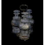 A Victorian silver plated three bottle cruet, containing three cut glass decanters and stoppers,