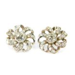 A pair of diamond floral cluster earrings, set centrally with rose cut diamonds, in a brilliant