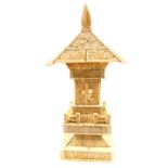 A late 19thC Japanese sectional carved bone model of a Buddhist shrine, the doors opening to