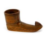 A Yugoslavian treen match holder carved as a boot, 11.5cm wide.