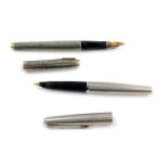 A Parker silver fountain pen, with a 14ct gold nib, and a further Parker fountain pen. (2)