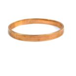 A 9ct rose gold bangle, with edge and turned decoration, 19.9g.