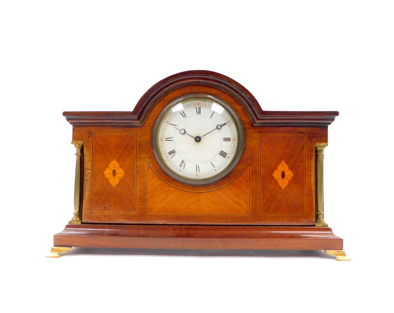 An Edwardian mahogany and inlaid mantel clock, circular dial bearing Roman numerals, clockwork