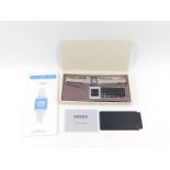 A Seiko Memo Diary, stainless steel cased watch with transmission circuit keyboard, instructions and