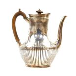 A Victorian silver fluted coffee pot, crest engraved with a demi lion rampant and motto 'Fide'.,