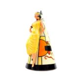 A Lorna Bailey pottery conical sugar sifter, fronted by an Art Deco lady, painted with geometric