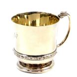 A George VI silver christening tankard, with Celtic band and dragon handle, engraved to 'Philip'.,