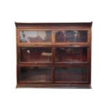 A Globe Wernicke type mahogany three section bookcase, raised on a plinth base, 113cm high, 128cm