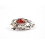 A silver and amber brooch, London 1980, 12.5g.