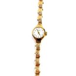 A Romer lady's 9ct gold cased wristwatch, circular dial bearing Arabic numerals, seventeen jeweled