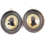 A pair of Georgian late 18thC silhouette portraits of a gentleman and lady, oval framed, 9.5cm high,