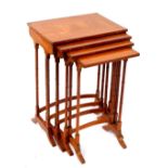 An Edwardian satinwood quarteto of occasional tables, with rosewood cross banding, raised on