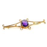 A 9ct gold and amethyst bar brooch, the oval cut amethyst approx 3cts, 4.0g.
