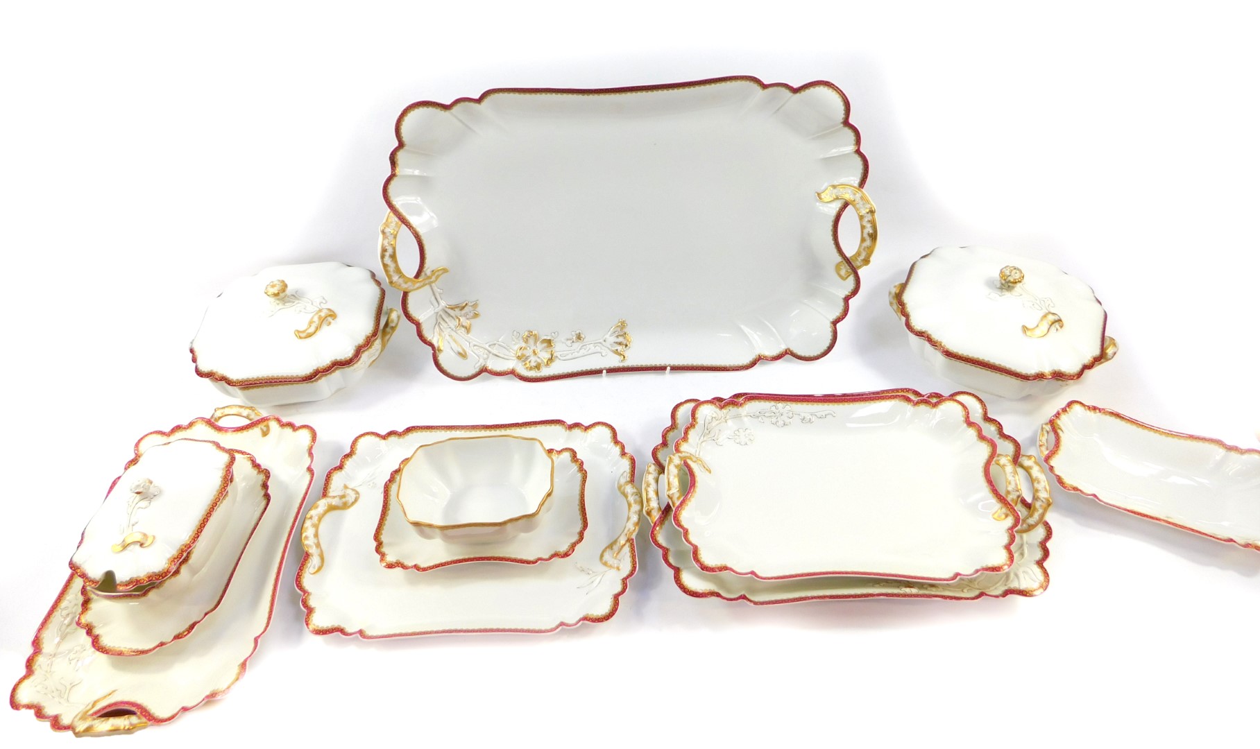 A Havilland Limoges porcelain part dinner service, moulded and gilt heightened with a floral