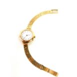 A lady's early 20thC 9ct gold circular cased wristwatch, white enamel dial bearing Arabic